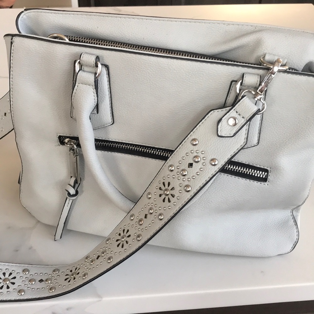 Grey purse with lots of pockets and floral detail